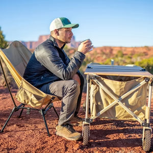 Man camping with DOD table and chair
