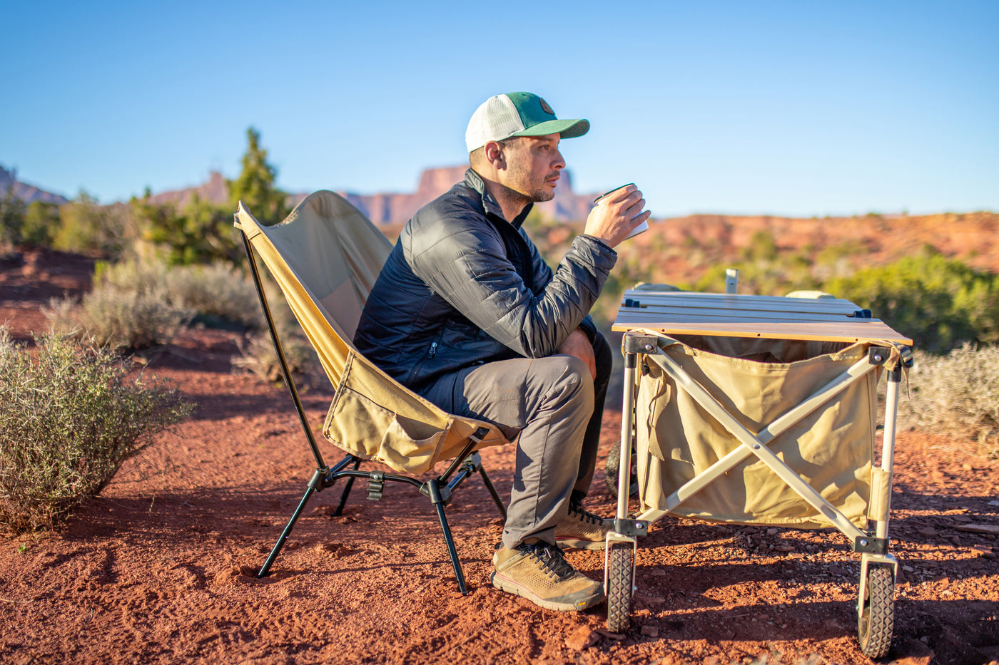Man camping with DOD Versa table