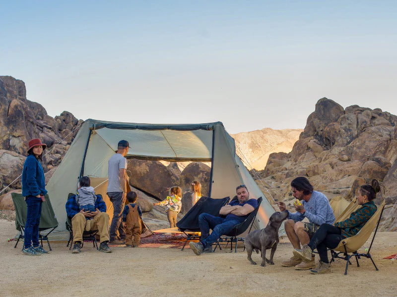 Friends relaxing outside a DOD tent