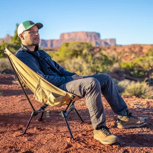 Man relaxing in a DOD camp chair.